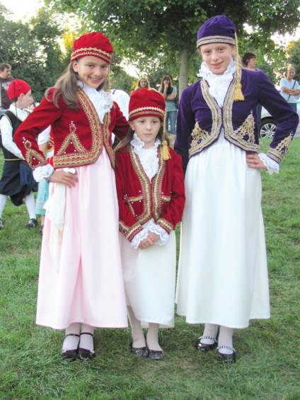 STEEPED IN TRADITION: The Mihailides sisters had the rare distinction of performing in three numbers of the Church of the Annunciation&rsquo;s Odyssey Dance Troupe. The sisters, who are dressed in authentic Greek costumes, are Katerina, Julianna and Eleni.