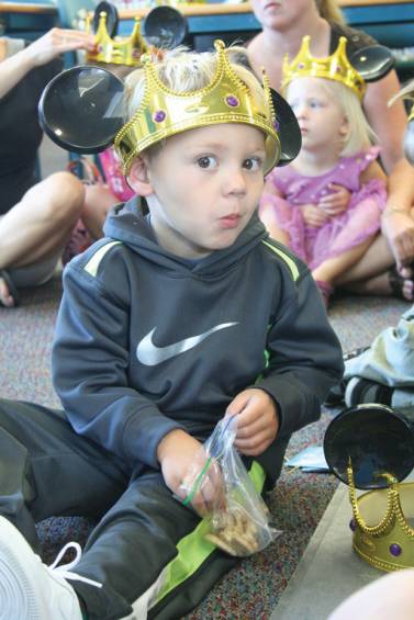 Three-year-old Alex Rey displays his new crown.