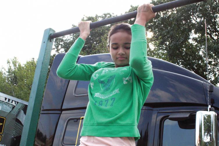 ONE IS BETTER THAN NONE: Toll Gate freshman Hannah Simas found the chin-up bar a challenge, one some of her classmates weren&rsquo;t willing to take.