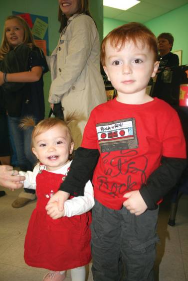 FAMILY FUN: Three-year-old Michael Farina holds hand with his little sister, 13-month-old Isabella.