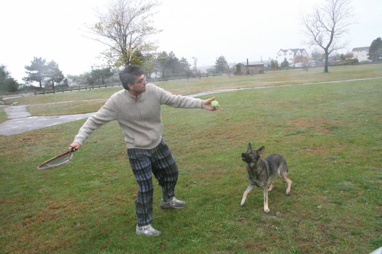 REALLY TAKING OFF: The wind added an extra boost to the flying tennis ball Monday morning as Paul DiChicco exercised his dog Max at Conimicut Point before retreating indoors to wait out the storm.