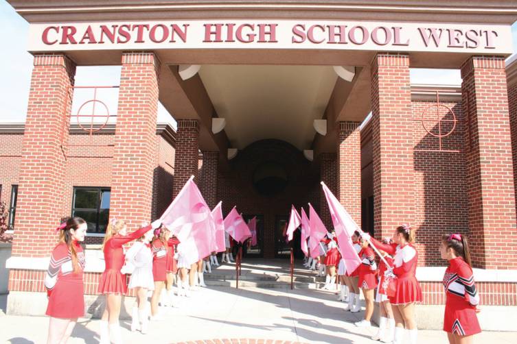 SCHOOL PRIDE: The Cranston West Falconettes and Westernettes line the outside walkway and inside hallway of Cranston High School West, in preparation for Carpano's arrival.