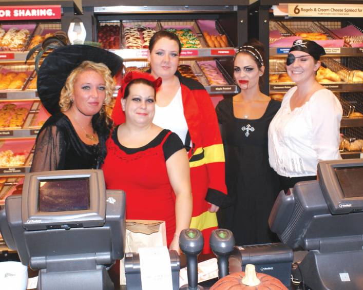 DUNKIN DEVILS: Greeting customers on Halloween night are Amanda Fritsche, Jessica Oliveira, Morgan Haibon, Kerri Smith and Lauren Moss, employees at the Dunkin Donuts on Sockanosset Cross Road.