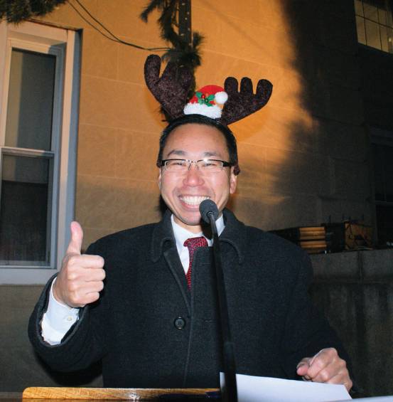 LIGHTING THE TREE: Mayor Allan Fung dons antlers as he welcomes the crowd to the city&rsquo;s annual tree lighting.