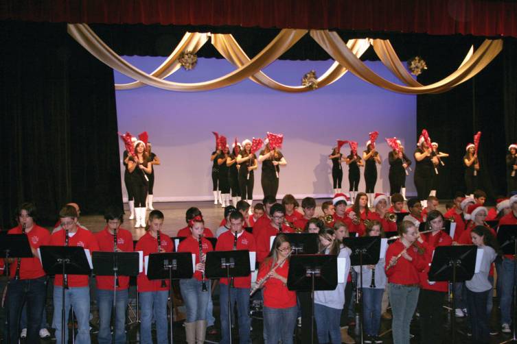 A GROUP EFFORT: The Westernettes, under the direction of Christine Baum, along with the Falcon Band under the direction of Art Montanaro, perform &quot;All I Want for Christmas is You.&rdquo;