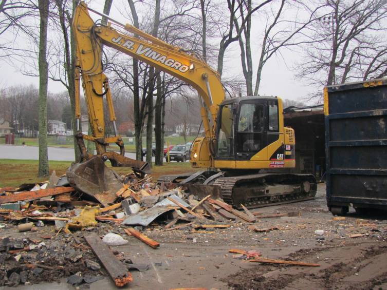 Several large pieces of demolition equipment filled Memorial Park as the one-time Parks and Recreation Office was torn down to make room for a new facility. J.R. Vinagro Corporation, a Johnston company, did the entire demolition job.