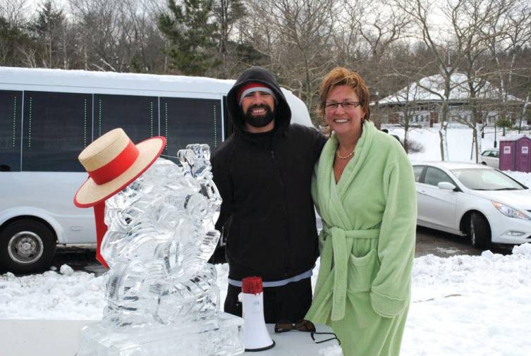 THE FROZEN CLAM: Ryan McGowan, owner of Laid-Back Fitness and creator of The Frozen Clam, poses for a photo with the Frozen Clam ice sculpture and Jo-Ann Schofield, senior vice president of the Rhode Island Mentoring Partnership.