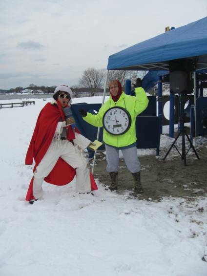 SEAWALL SIDEKICKS: Amy &ldquo;Elvis&rdquo; Beth (left) of Cranston provided some entertainment prior to Monday&rsquo;s Seawall Splash at Oakland Beach. The countdown was kept by Priscilla Ingram, who carried an oversized clock leading to the annual plunge into Greenwich Bay.