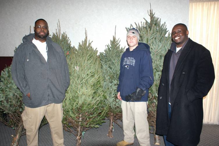 SPECIAL DELIVERY: Pictured are Praise Tabernacle Men&rsquo;s Ministry Leader Dan Bullock, Thomas Cottam of Confreda Farms &amp; Greenhouses and parishioner Gerald Price. Confreda Farms &amp; Greenhouses donated six Christmas trees for the festivities during the Home-4-Homeless Holiday Dinner.