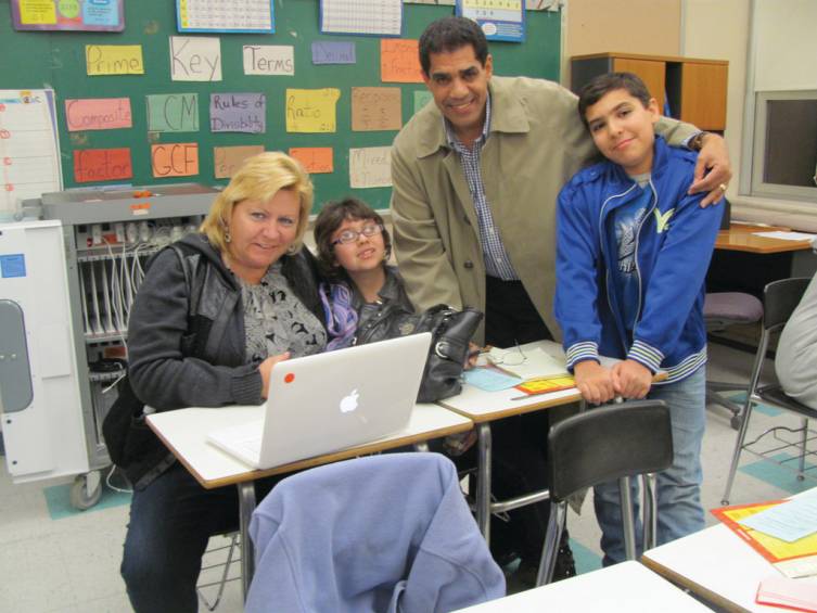 Kerry Westerman (left) joins Julie Rodriguez, Katie Rodriquez and Alexander Rodriguez at one of the five stations featured in Ferri Middle School&rsquo;s Family Math Night.