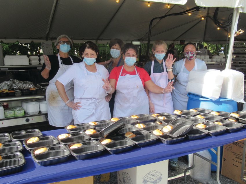 HODA&rsquo;S HAPPY HELPERS: Ladies like Dinia Fotopoulos, Zalfra Geha, Hoda Daiaa, Thalia Wood and Patty Andriotis enjoy a brief break from packing Greek dinners during last weekend&rsquo;s three-day food fest in Cranston.