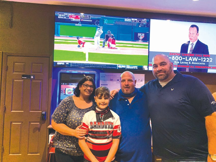 FIGHTING THE GOOD FIGHT: Anthony, along with his mom Diana, dad Chris and City Council President Michael Farina taking a moment from watching the Yankees game on the TV to say thanks to everyone for their support.