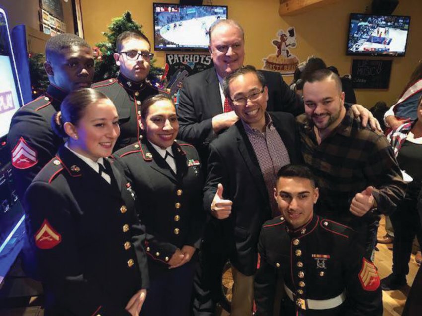 FOR THE KIDS: Ed Brady and Mayor Allan Fung are seen during a previous For the Kids Toy Drive event held at the Thirsty Beaver in Cranston, along with members of the U.S. Marine Corps.