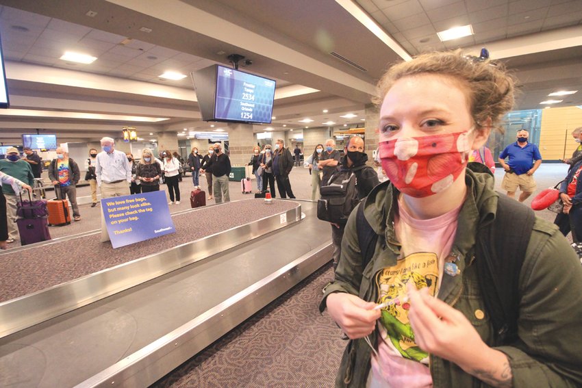 COULDN&rsquo;T RESIST THE FARES: Graphics arts designer Megan Comtois, who returned Friday from a trip to visit relatives in Florida, said she couldn&rsquo;t pass up the low cost fares to make the trip.