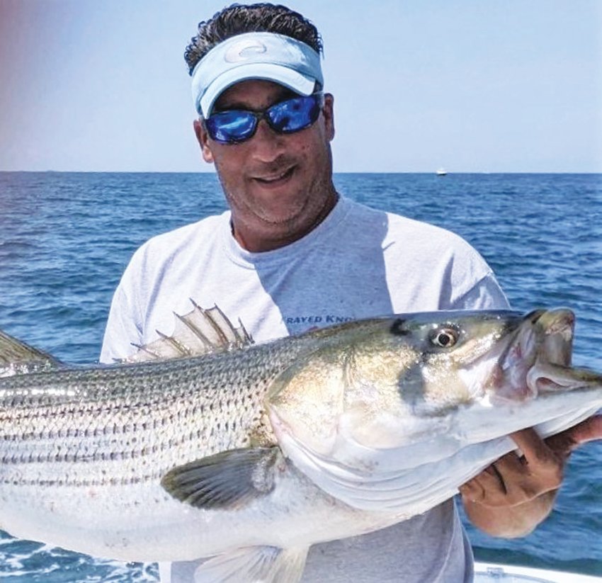 WINNING BASS: Richard Lipsitz of North Kingstown with the 47.5-inch striped bass that took first place, his team &ldquo;Frayed Knot&rdquo; took the team award too in the Block Island Inshore Tournament.