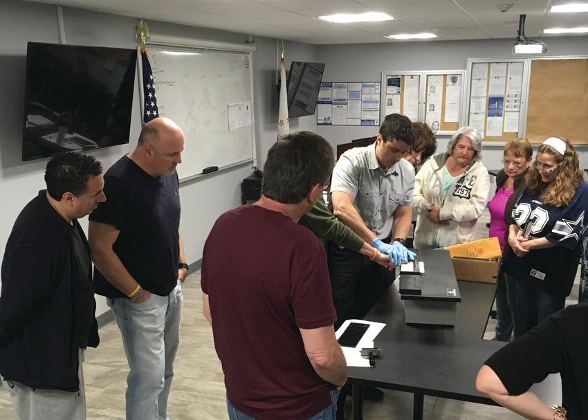 MASTERING FINGERPRINTS: Members of a previous Citizens Police Academy learned how to properly take and roll fingerprints during their nine weeks with the Johnston Police Department.