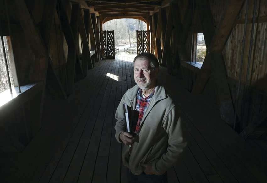 MEET THE AUTHOR: Martin Podskoch, author of &ldquo;Rhode Island 39 Club&rdquo; and &ldquo;Rhode Island Conservation Corps Camps,&rdquo; is pictured on Comstock&rsquo;s Bridge in East Hampton, Connecticut.