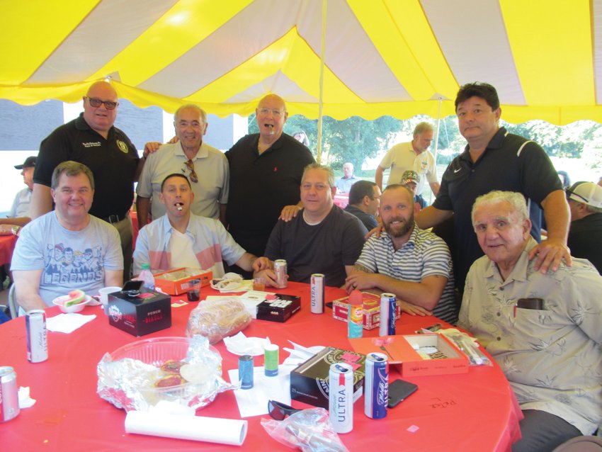 FATHER&rsquo;S FLOCK: Rev. Peter J. Gower (third from left top) joins and thanks parishioners like Tom Kowal, Joe Grasso, Rob Desiderato, Norman Thompson, Vito Montecalvo, Renato Montecalvo, Peter Lombardi and Mike Capobianco who were part of the record crowd for the unique 5th annual OLG event.