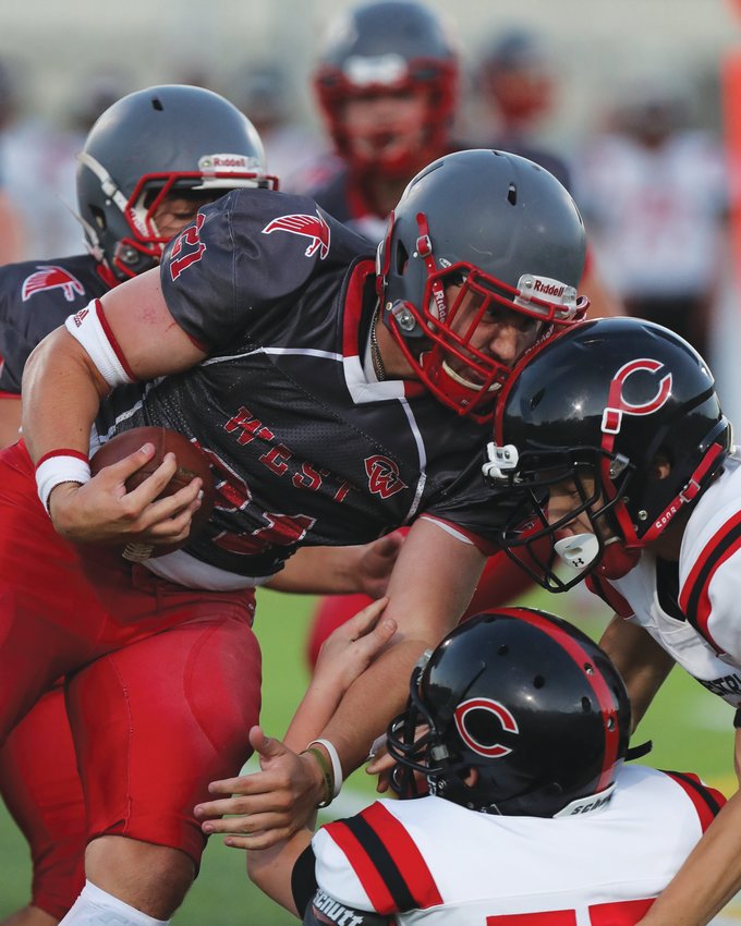 THROUGH TRAFFIC: West&rsquo;s Braydan Stetson rushes through defenders.