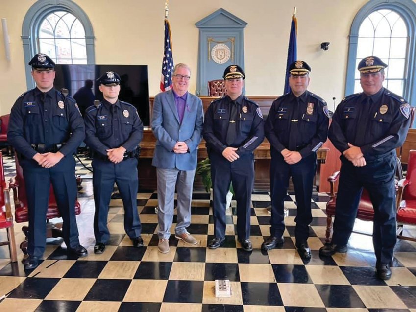 WELCOME TO CRANSTON: From left, Officer Michael Schiappa, Officer Michael Nolan, Mayor Ken Hopkins, Col. Michael Winquist, Maj. Todd Patalano and Maj. Robert Quirk gather during last week&rsquo;s swearing-in ceremony at City Hall.