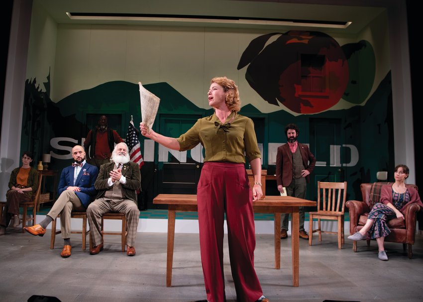 IN THE ENSEMBLE: Nora Eschenheimer (Thea Hovstad) is seen in the foreground during &ldquo;A Lie Agreed Upon.&rdquo; Pictured the background, from left, are Aryn Mello Pryor (Petra Stockman), Jonathan Higginbotham (Peter Stockman), Jomo Peters (Captain Horster), Fred Sullivan Jr. (Aslaksen) and Donnla Hughes (Katherine Stockman).