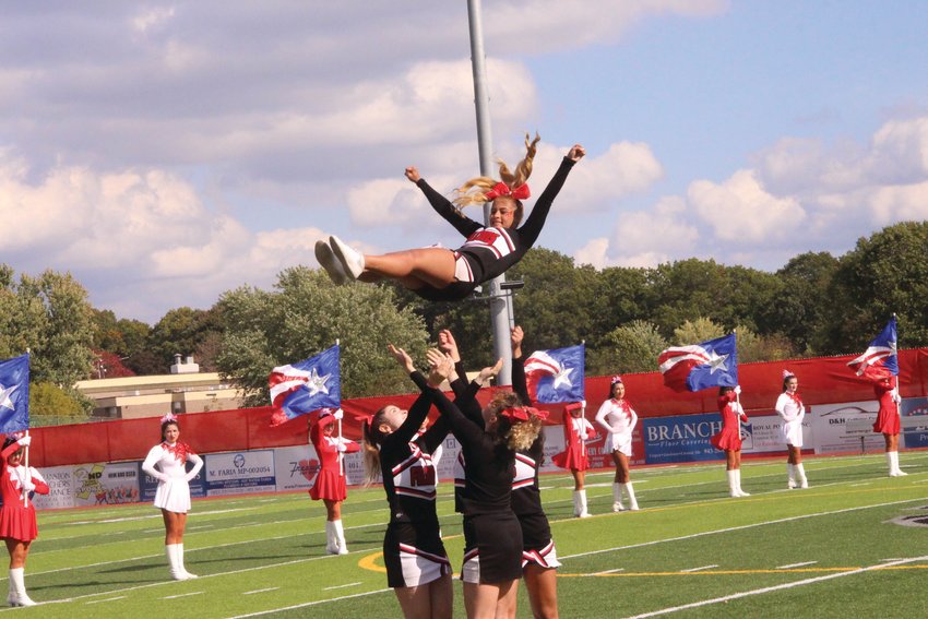 FLYING HIGH: The Cranston High School West Falconettes, Westernettes and cheerleaders entertain the crowd during the school&rsquo;s Oct. 22 homecoming.
