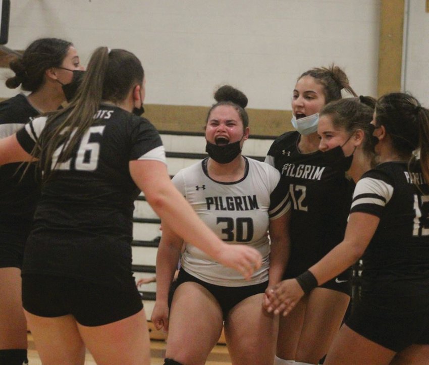 PLAYOFF BOUND: The Pilgrim girls volleyball team celebrates after a point last week.