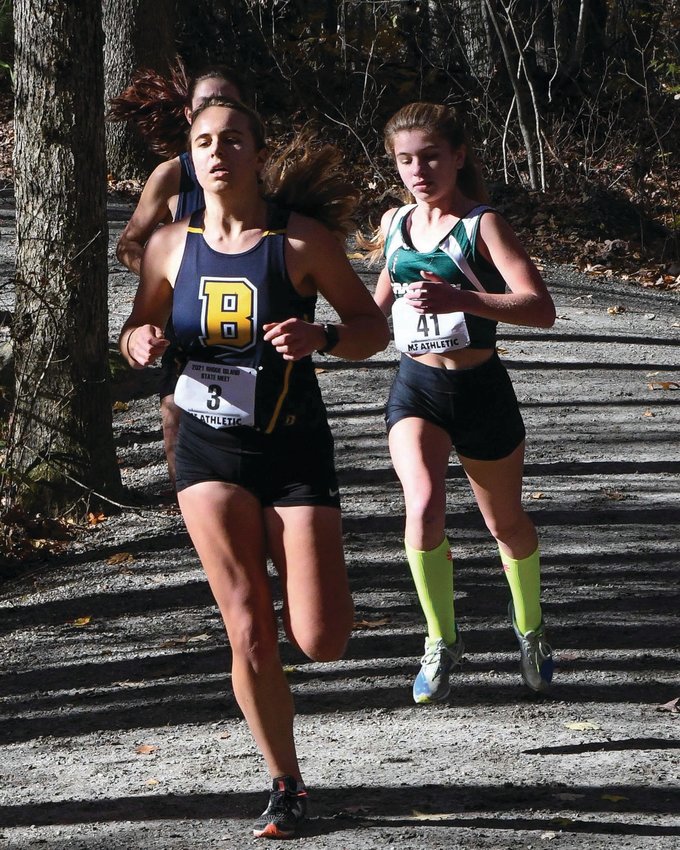 STATE MEET: Cranston  East&rsquo;s Maddison Dutra  runs along the course at  Ponaganset High School  during last week&rsquo;s state  championship meet. The  Lady Bolts had a solid outing,  finishing eighth place  overall.