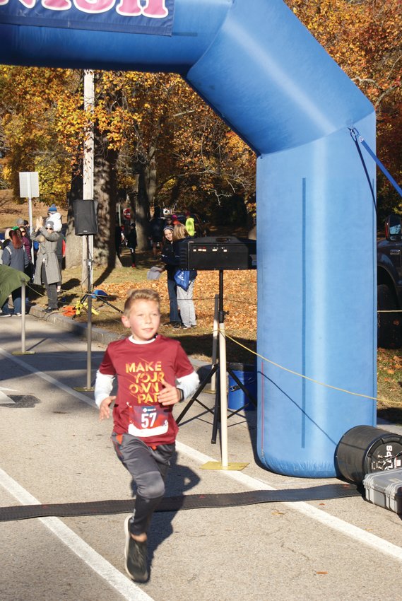 KIDS&rsquo; WINNER: First to cross the finish line in the 1-Mile Kids&rsquo; Run was Xander Guilhardi, 7. He had a time of 6:55.