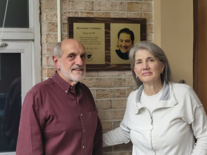 INSPIRING LIFE: Sallyann and Jack DiIorio were moved to tears by the tribute plaque family and friends arranged to have affixed to the wall behind the circulation desk in the high school library.