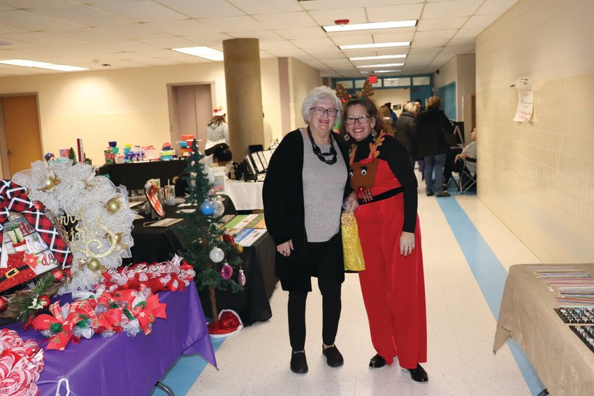 HAPPY HOLIDAYS: Melissa Patrone, one of the many long-time volunteers who has worked tirelessly in presenting past PTSO Holly Fairs at Johnston High School will be decked out in holiday garb and welcoming vendors, shoppers &ndash; and Santa Claus - to the 10th annual event on Saturday, Dec. 4.