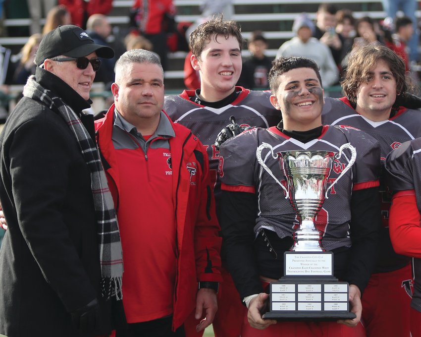 GETTING THE WIN: Cranston Mayor Ken Hopkins (far left) presents the Thanksgiving trophy to West&rsquo;s Tom Milewski,  Jacob Robert, Teddy Shakelford and Anthony Perrotta.