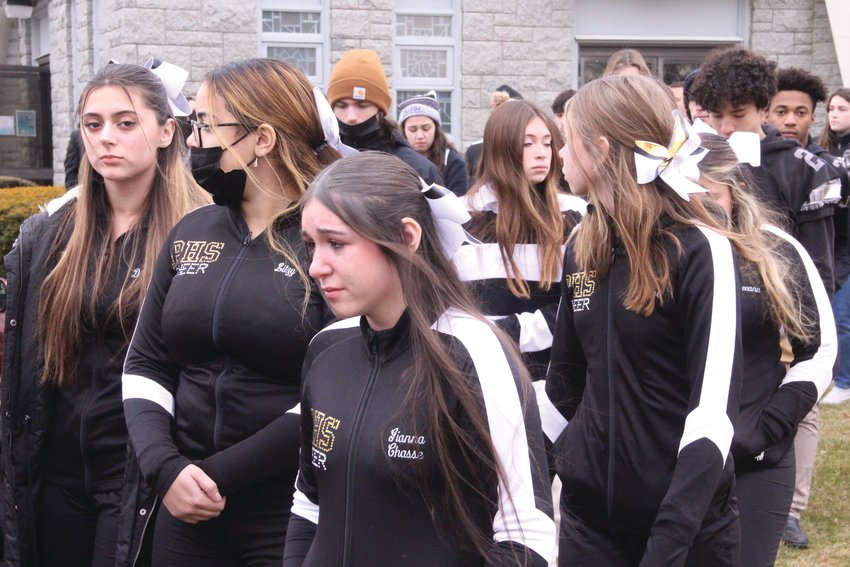 WHITE AND BLACK LINE: Pilgrim colors were the chosen attire for the scores of Pilgrim students who attended Saturday&rsquo;s Mass of Christian Burial for their beloved Principal Gerald Habershaw. Students lined the walk in front of St. Kevin Church before and after the service.
