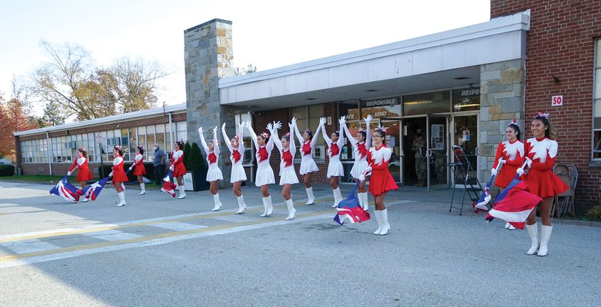 PRECISION ON DISPLAY: The Cranston West Falconettes Precision Dance and Flag Teams perform for Glen Hills students, faculty, and guests during the school's Veterans Day Celebration  on November 10.