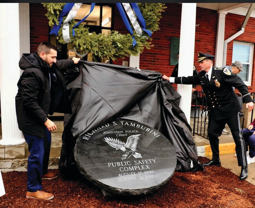 MIGHTY MOMENT: Johnston Town Council Vice President Joseph Polisena Jr., who proposed the naming of the Richard S. Tamburini Public Safety Complex and JPD Chief Joseph P. Razza, remove&nbsp; the protective covering at the conclusion of Saturday&rsquo;s super ceremony for the former JPD chief in honor of his 54-year career in law enforcement.
