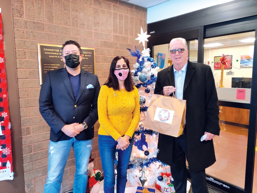 READY WORK: Mayor Ken Hopkins led by example when he took time from his schedule to  deliver a holiday meal or two in the community. Along with the Mayor were David Quiroa and  Jennifer Kevorkian, Social Services Director.