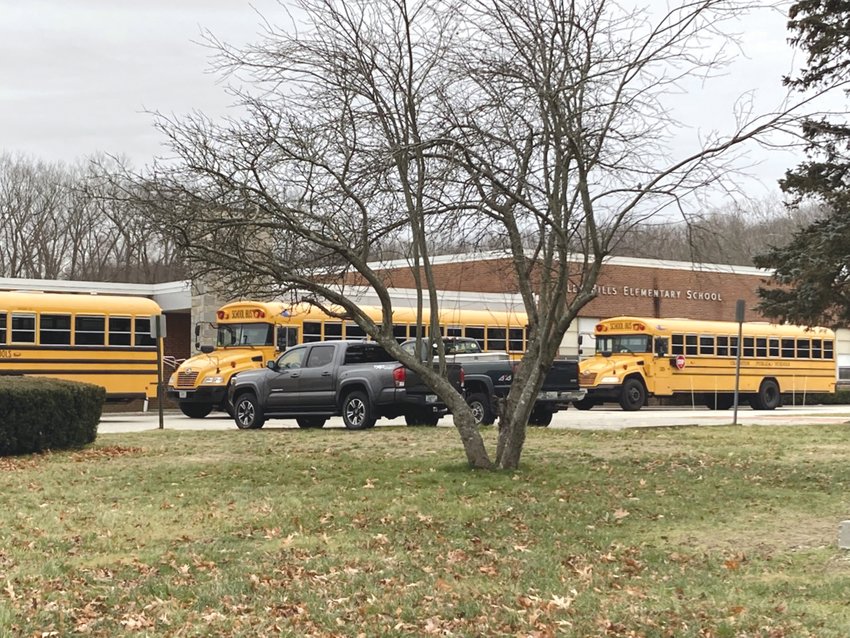 BACK TO THE BUSES: Cranston school buses line up outside Glen Hills Elementary School around 3 p.m. on Jan. 3 to bring students home after their first day back since the New Year.