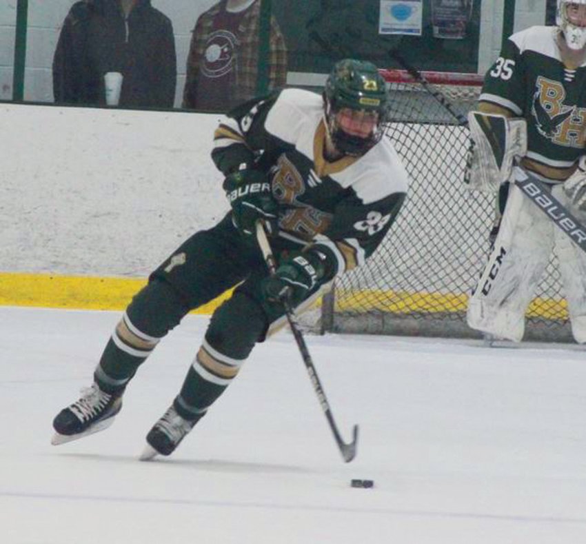 STRONG START: Bishop  Hendricken&rsquo;s Colton Whitfield  takes the puck up the  ice last week against La  Salle Academy during the  teams&rsquo; exhibition in Smithfield.  The Hawks rolled past  their rival 4-1 and have  started this season with a  3-0 league record. (Photos  by Alex Sponseller