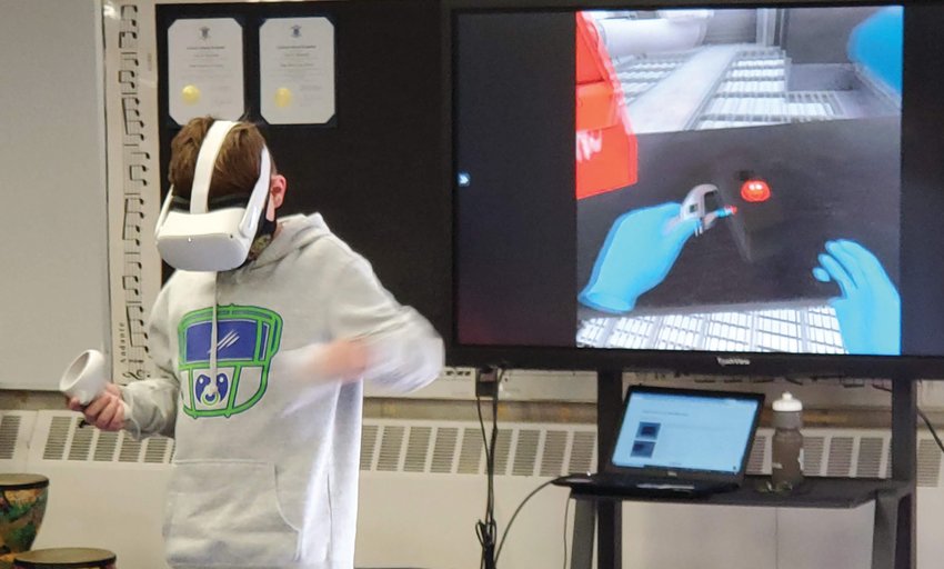 THE OTHER VIRTUAL LEARNING: A Scituate student adjusts a machine in a virtual reality environment. The Scituate Career &amp; Technology Education program uses virtual reality and GIS technology to help students explore potential career options.