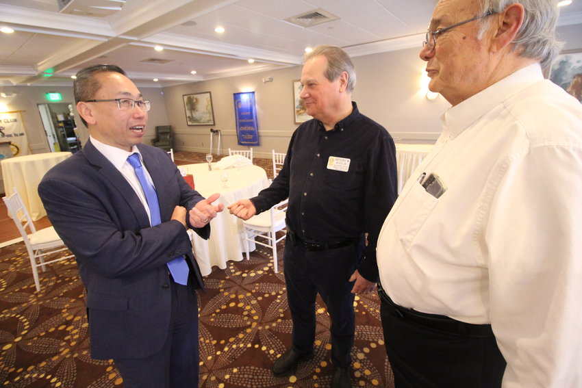 POLITICS ON THE MENU: Allan Fung talks with Anthony Bucci following his talk before the luncheon meeting of the Warwick Rotary Club at Chelo&rsquo;s last Thursday.