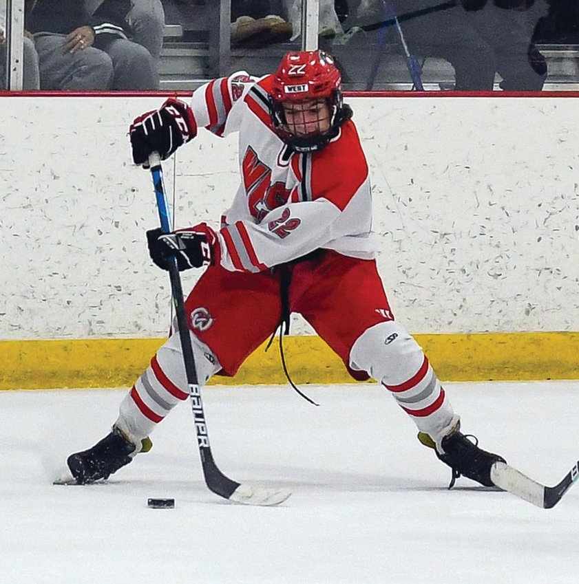 FINAL PUSH: Cranston&rsquo;s  Jared Prior handles the  puck last Saturday night  against Rogers/Middletown/  Rocky Hill on Senior  Night. The two teams battled  to a 1-1 tie. Cranston  has one game remaining in  the regular season and is  looking to win as the division&rsquo;s  final playoff seed is  still up for grabs.