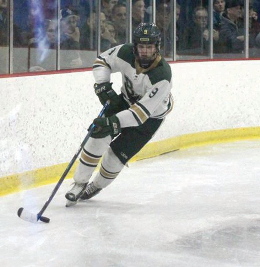 ALONG THE BOARDS: Hendricken&rsquo;s Alex Giuliano works his way along the boards against La Salle last week.