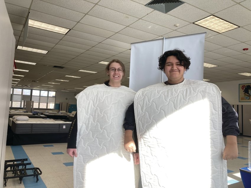 MIGHTY MUSICIANS: JHS percussionist Johnathan Guilmette and Trumpet player Gerson Cabrera show off their mattress outfits to promote Saturday&rsquo;s sale that helped fund the music department&rsquo;s trip to Williamsburg, Virginia. The students left at 5 a.m. Thursday morning.
