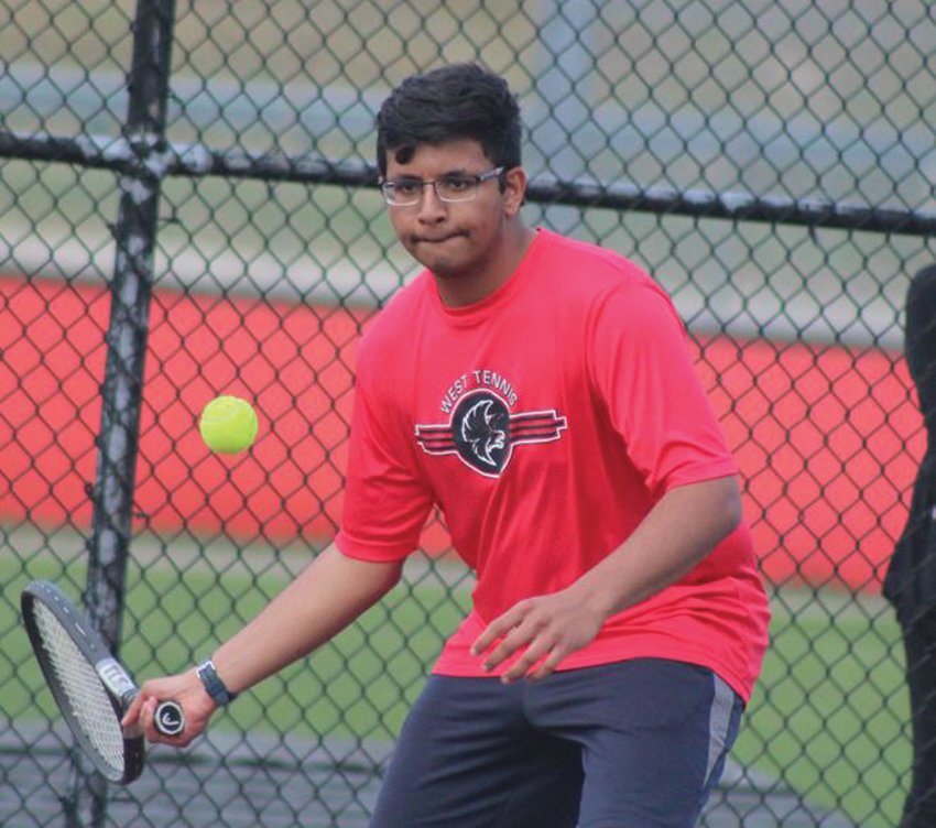 EYE ON THE PRIZE: Cranston West&rsquo;s Aditya Godbole returns a shot against Cumberland last week in a match at home. The visiting Clippers took home a 5-2 win to hand the Falcons their first loss of the season. The 3-1 Falcons are off to a solid start and are looking to make some noise in Division II this spring. (Photos by Alex Sponseller)