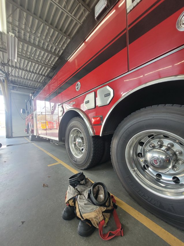 NEW TRUCK, OLD TRUCK: The Johnston Fire Department&rsquo;s ladder truck will be put on reserve status once the town receives its new truck. The old truck has only been in service for less than eight years.