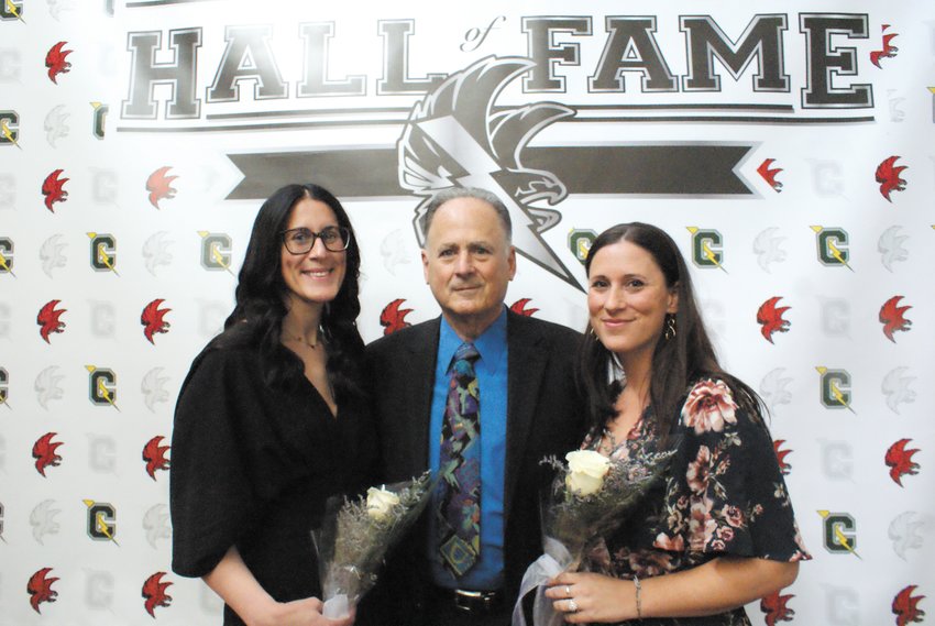 THE HOST: Michael Traficante, who ran the Athletic Hall of Fame, is pictured with his two daughters Lindsey and Lisa, who were both members of the 2003 Softball team and were inducted April 30 as State Champions.