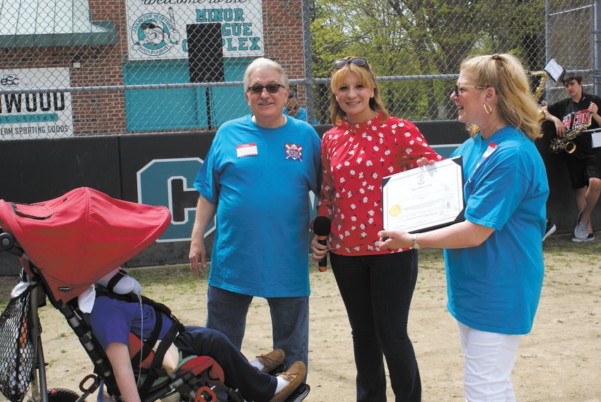 OPENING DAY: This past Saturday was opening day for 401 League of our Own. Pictured are Rep. Barbara Ann Fenton Fung as she presented a certificate to Frank and Nina Fiasconaro and their son Nicholas.