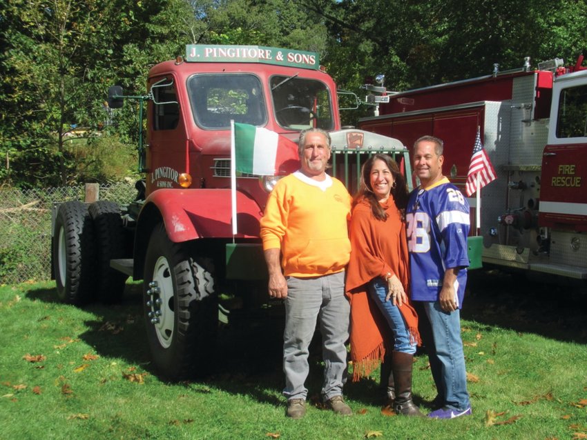 MIGHTY MEMORIAL: This is just one of the vintage vehicles &mdash; a 1952 Sterling White HB Tractor that the late Joseph Pingitore III, at left, owned and operated and will be on display throughout Sunday&rsquo;s Ocean State Vintage Haulers 28th Annual Antique Truck Show in Johnston. Here Pingitore poses with his sister Francine Pingitore and brother David David Pingitore at a past show.