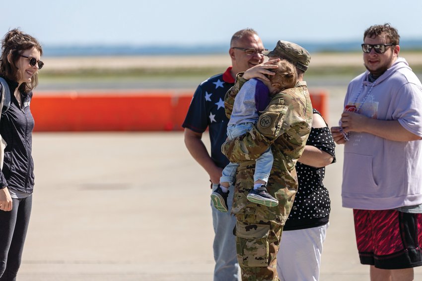 GOODBYES: Specialist Connor Wood from Killingly, Connecticut, says goodbye before deployment. The Rhode Island National Guard hosted a departure ceremony for Alpha Company, 1-182nd Infantry Battalion, nicknamed &ldquo;Attack&rdquo; Company, at the Army Aviation Support Facility on Quonset Air National Guard Base on Memorial Day.