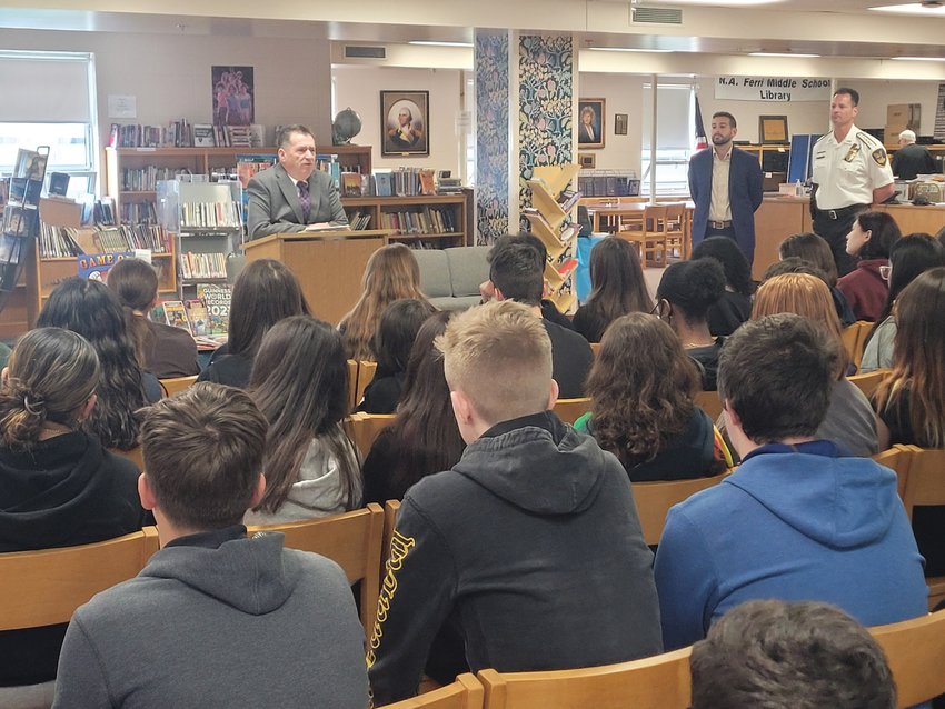 LAW DAY: Rhode Island Superior Court Associate Justice Joseph A. Montalbano, Johnston Town Council Vice President and mayoral candidate Joseph Polisena Jr., and Johnston Police Chief Joseph P. Razza stood in the Nicholas A. Ferri Middle School Library, facing a large group of civics students on Law Day last month.&nbsp;